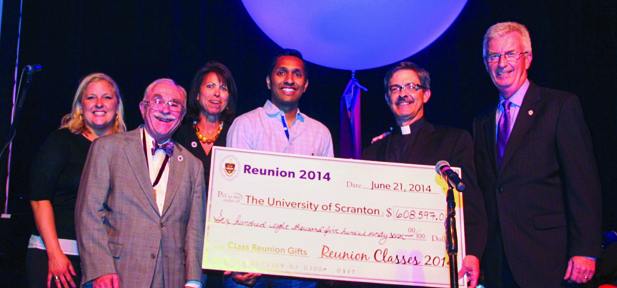 Representatives of Reunion Milestone Classes gather to present a check to University President Kevin P. Quinn, S.J., on behalf of classes ending in 4 and 9. Left to right: Erin O’Malley Stewart ’94, Frank Homer, Ph.D. ’64, Rachele Mackin Browning ’84, Robin Raju ’04, Fr. Quinn and Gary Olsen, vice president for University Advancement.