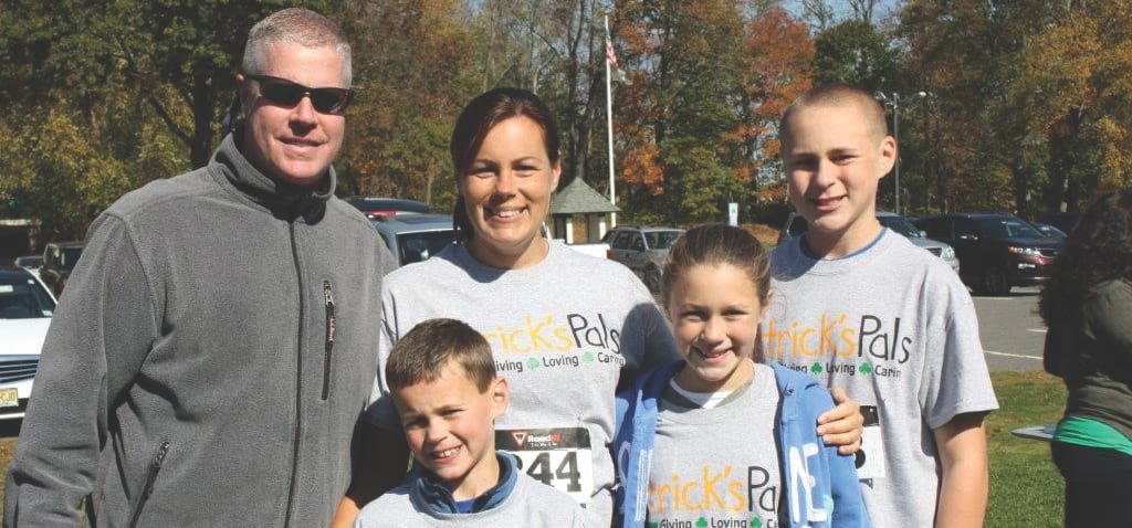 Clockwise, from left: Dan Tempone ’90, Jeannie Tempone, Daniel Tempone, Caroline Tempone and Matthew Tempone participate in the annual Patrick’s Pals 5K Run and 1-Mile Walk.