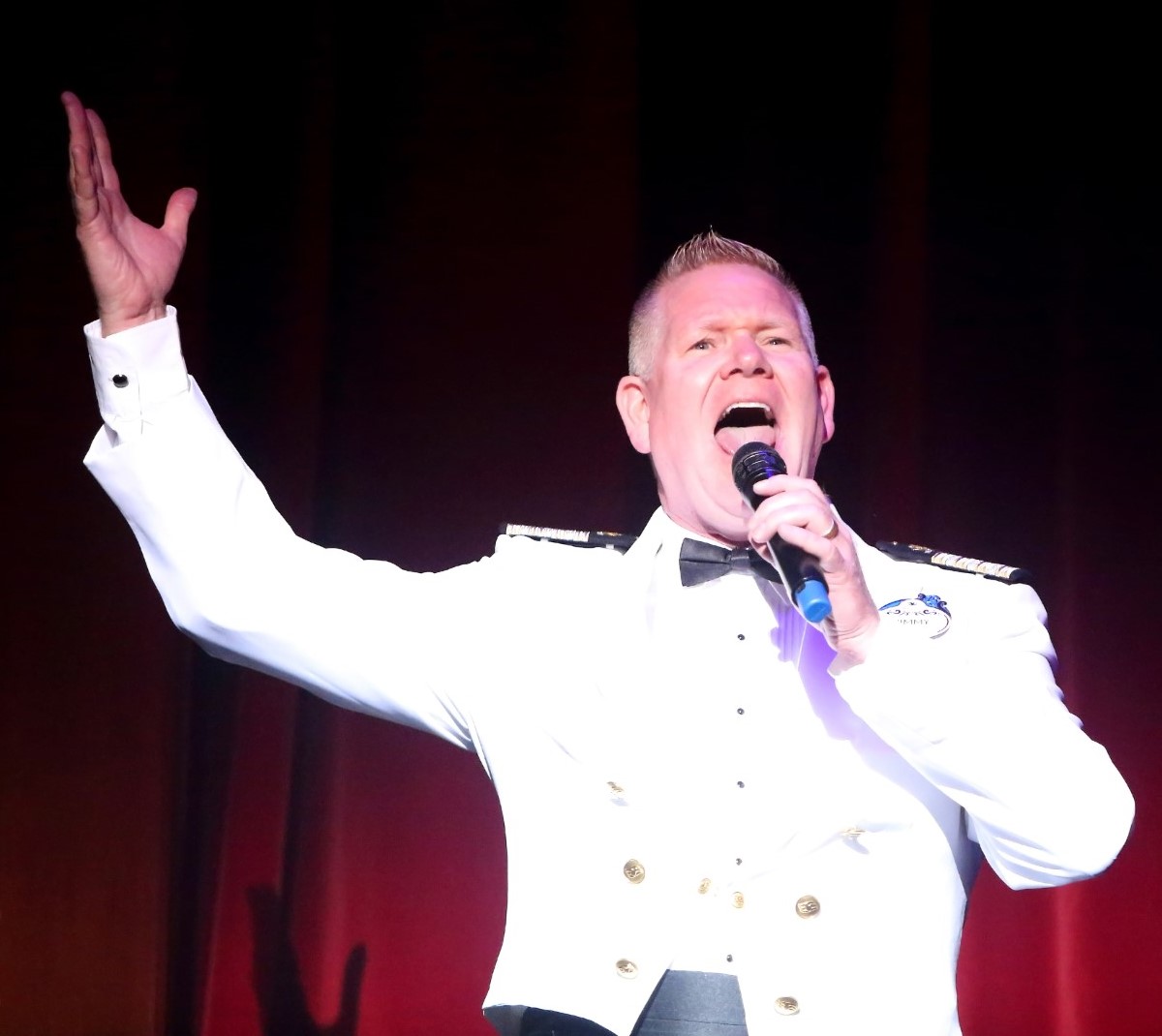 Jimmy Lynett '97, executive entertainment at Disney Cruise Lines, on the job at the Walt Disney Theatre on the Disney Wonder.