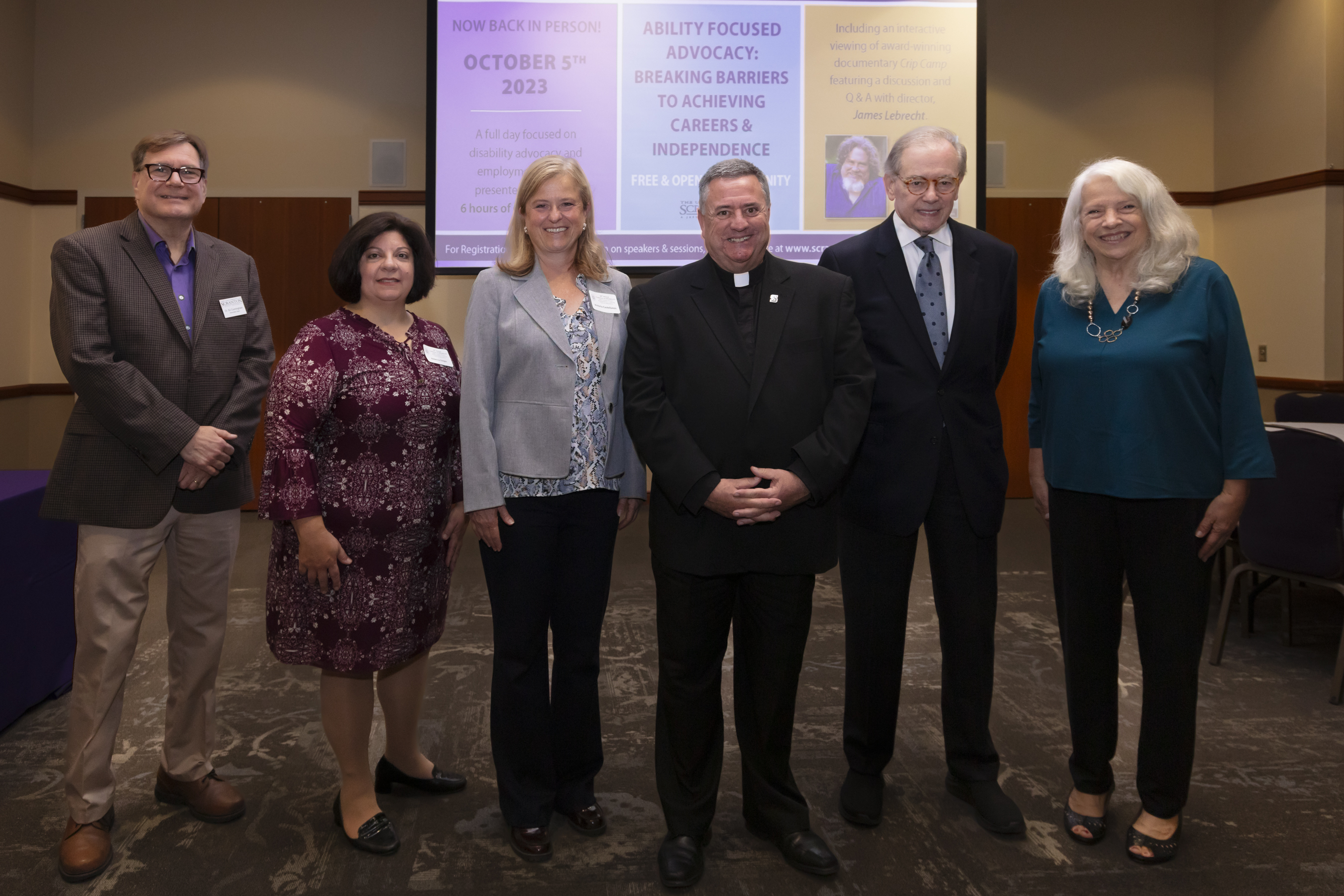 From left, are William J. Cunningham, Ph.D., associate dean of the Panuska College of Professional Studies; Rebecca S. Dalgin, Ph.D., professor of counseling and human services; Victoria Castellanos, Ph.D., dean of the Panuska College of Professional Studies; Rev. Joseph G. Marina, S.J., president of The University of Scranton; Edward Leahy, university benefactor and honorary chair of the conference; Lori A. Bruch, Ed.D, chair of the Department of Counseling and Human Services.