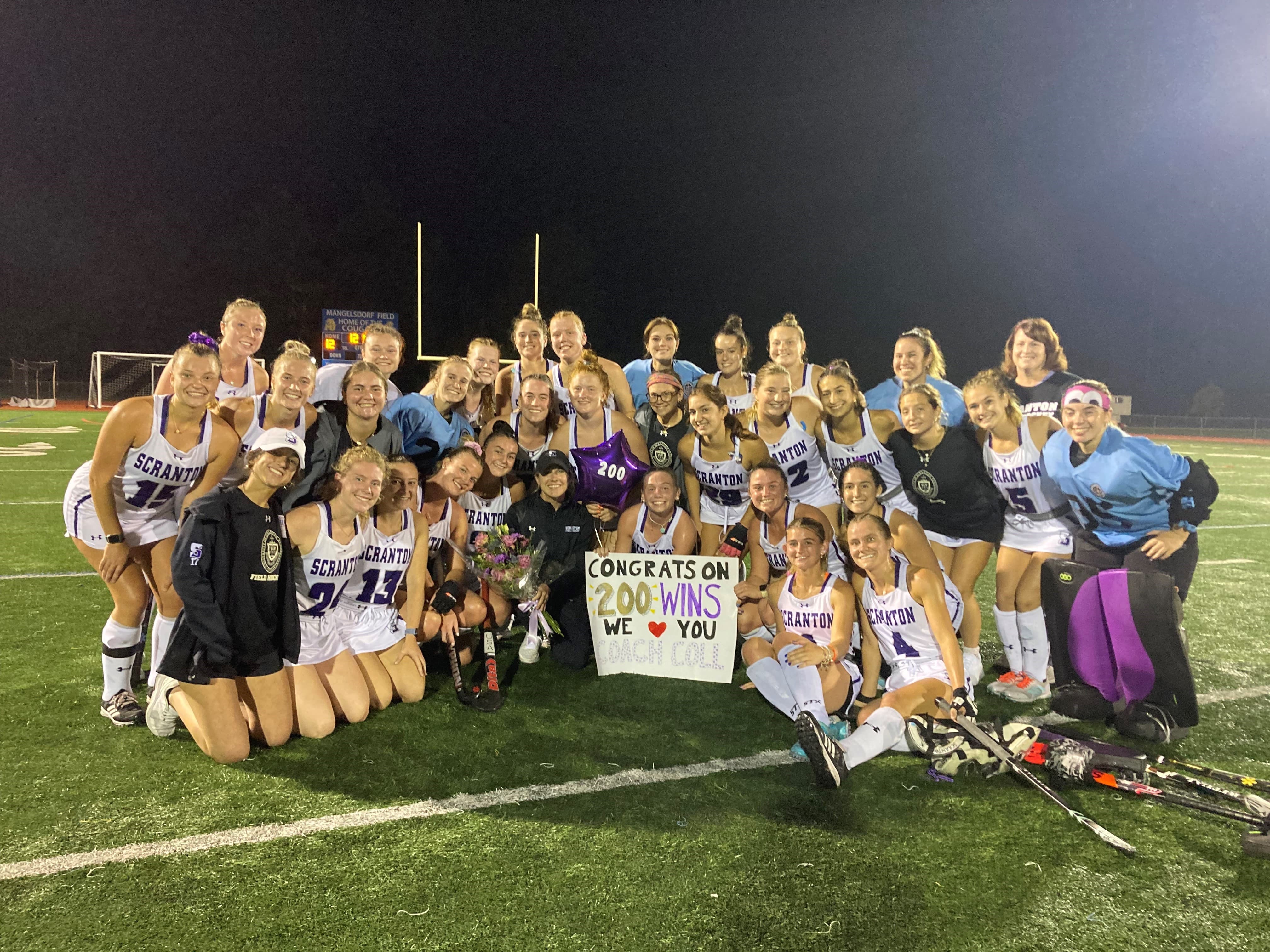 Head coach Jamie Spangler, shown at far right, who notched his 200th career victory in the fall with a 3-1 win over DeSales is shown with The University of Scranton volleyball team.