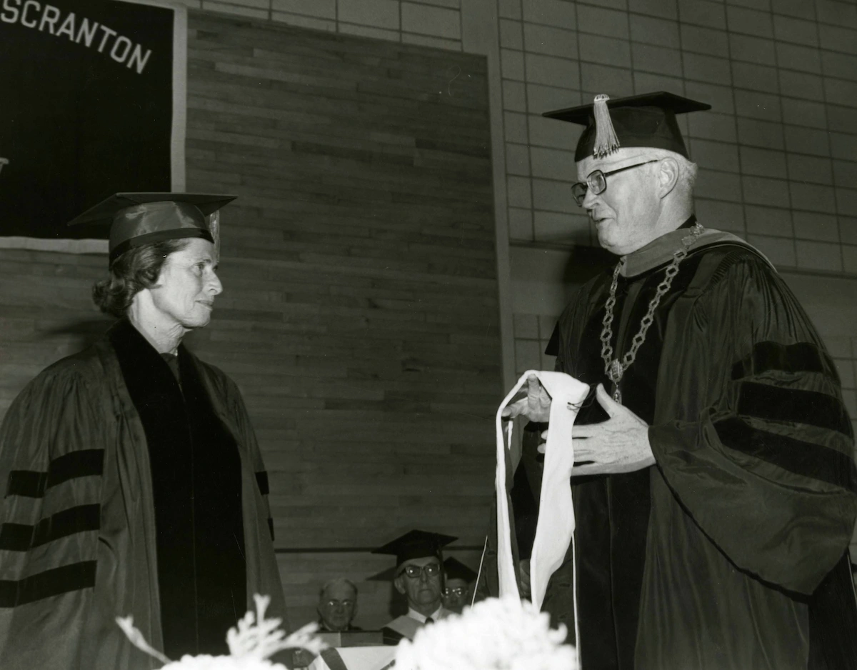 University president presenting award to Mary Scranton 1977